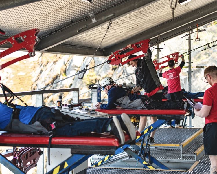 people getting ready on the zip lines at zip world velocity in wales