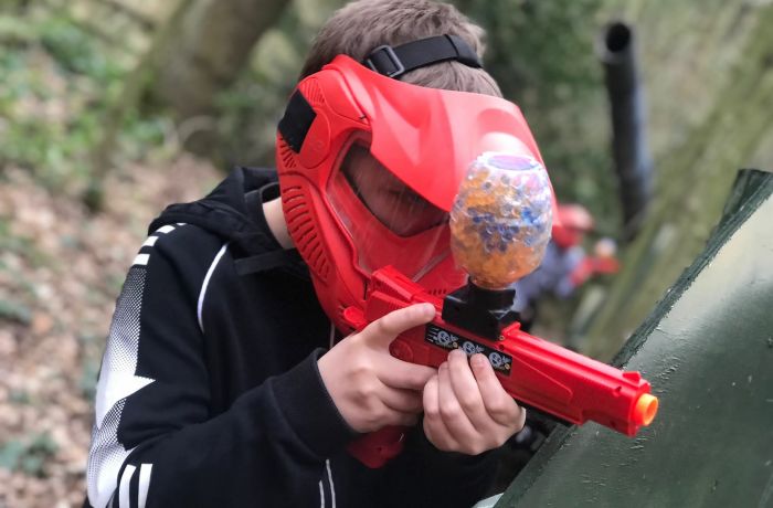 Young boy shooting a gelly blaster