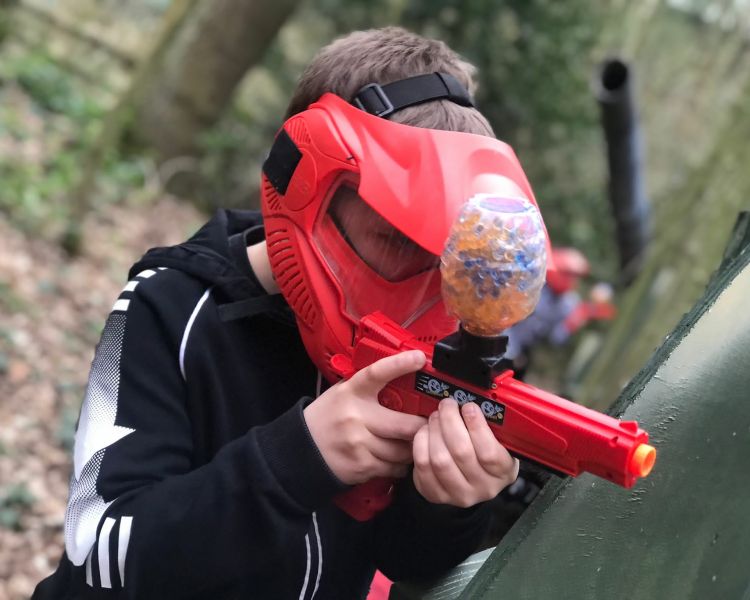 Young boy shooting a gelly blaster