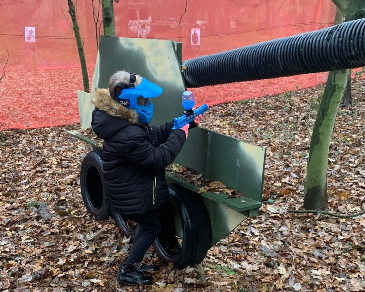 Young child shooting a gel blaster