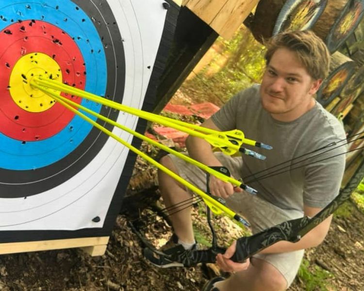 Man in an archery experience