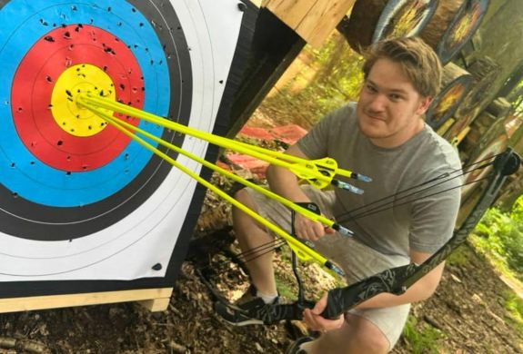 Man in an archery experience