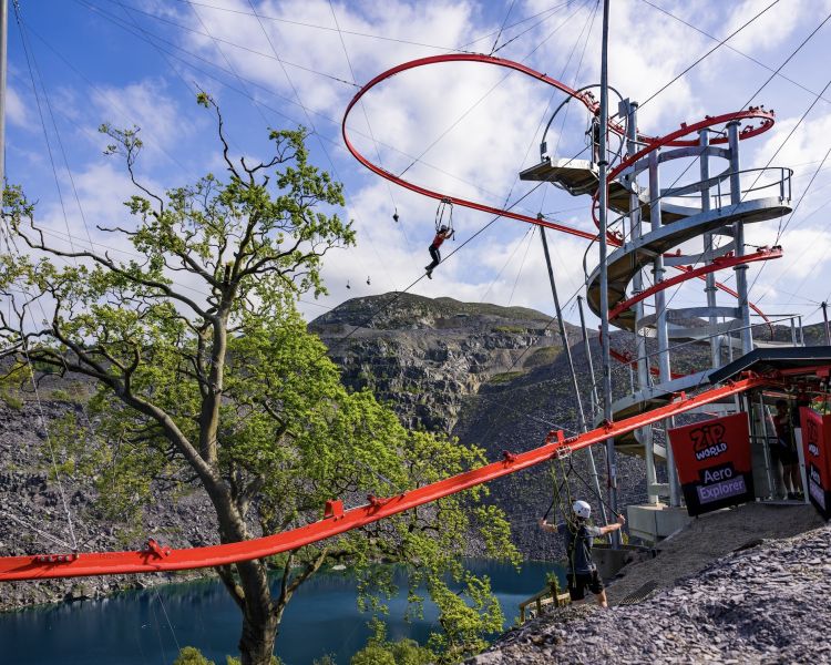 man on the zip world aero explorer overlooking the quarry and lake