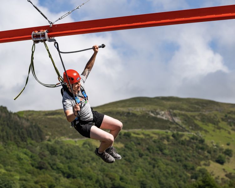 man on the zip world aero explorer overlooking the quarry and lake