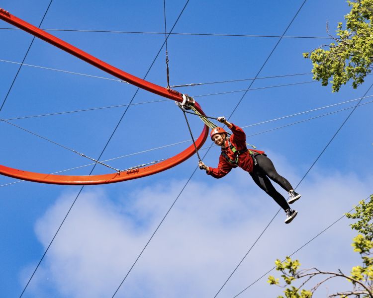 woman going around the zip world aero explorer in wales
