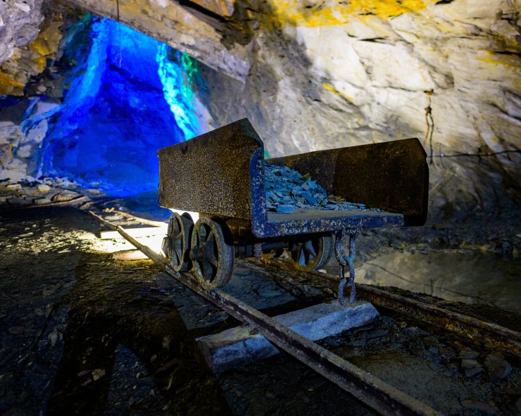 an old cart on a track used by mine workers in the past seen on the zip world llechwedd deep mine tour