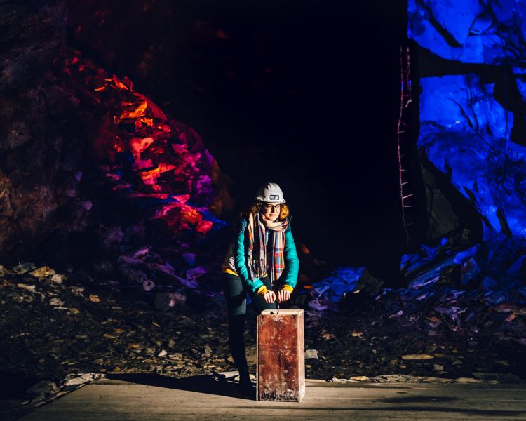 a woman on the zip world llechwedd deep mine tour