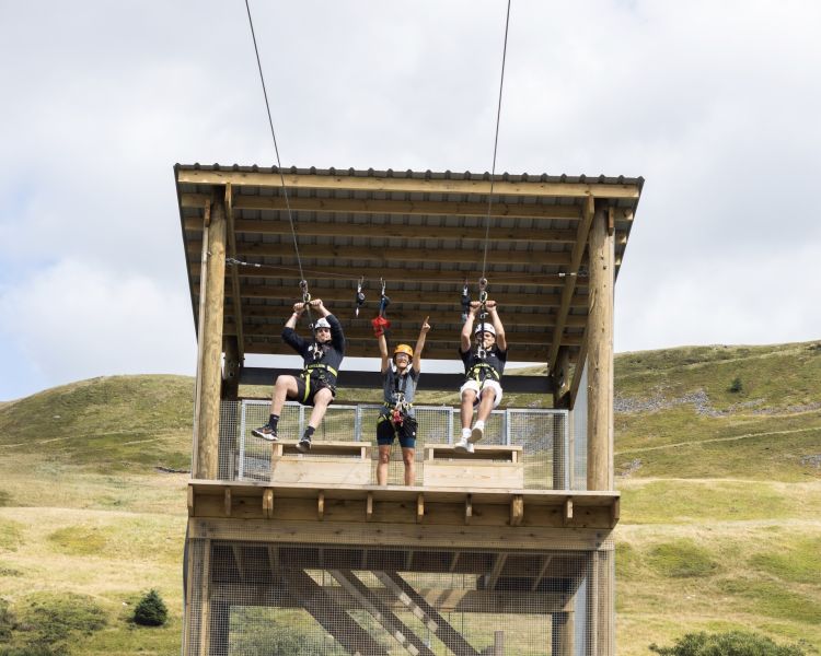 two people setting off from the platform at zip world tower flyer at the tower colliery location