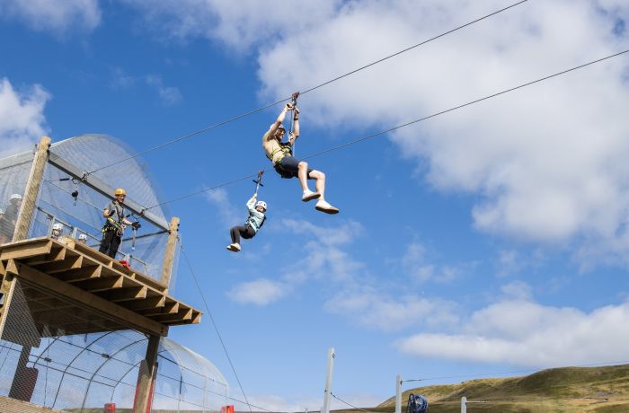 person on the zip line at zip world tower flyer at the tower colliery location