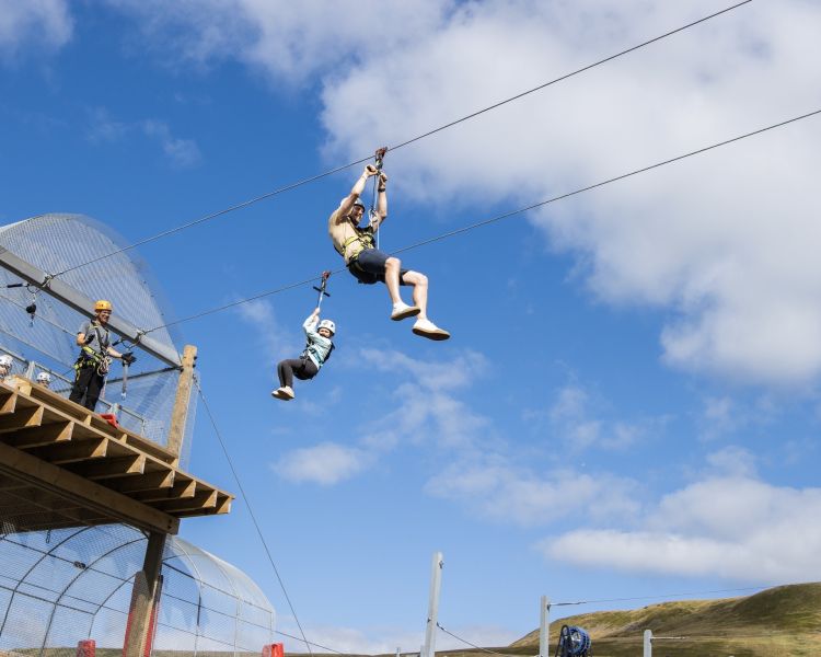 person on the zip line at zip world tower flyer at the tower colliery location