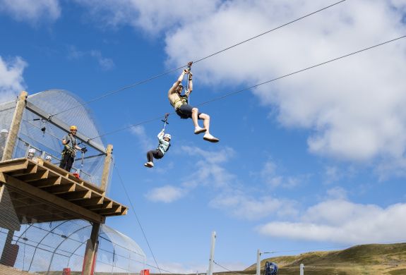 person on the zip line at zip world tower flyer at the tower colliery location