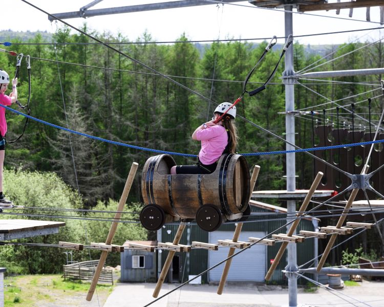 two young girls on the zip world tower climber in south wales