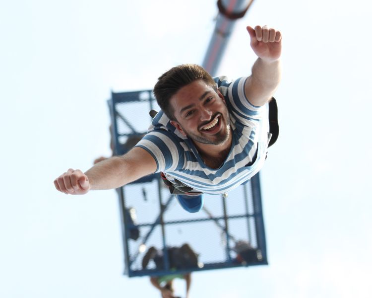 man doing a bungee jump on a bungee jump experience day