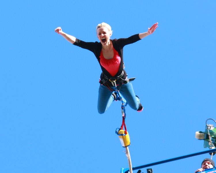 woman doing a bungee jump on a bungee jump experience day