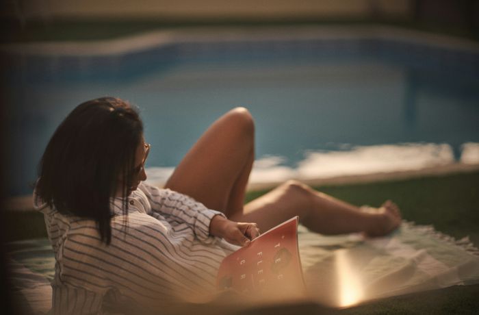 Lady by a pool at evening...