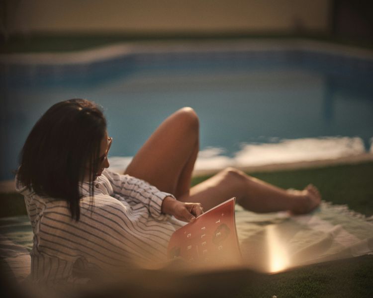 Lady by a pool at evening...