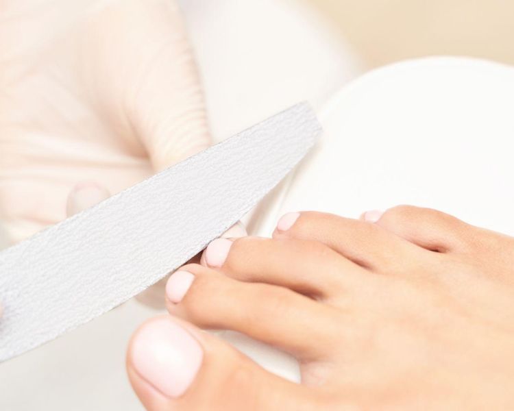 A pedicure treatment on a foot
