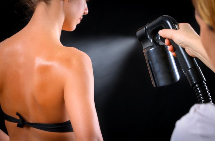 Woman having a full body spray tan