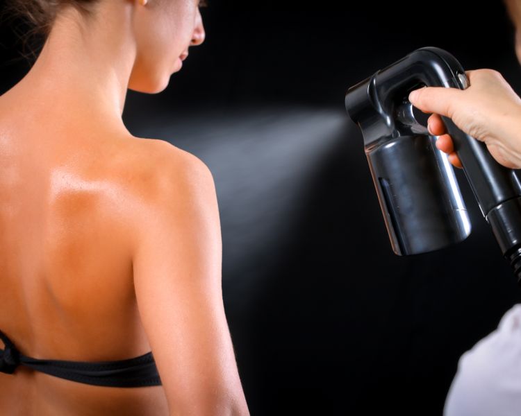 Woman having a full body spray tan