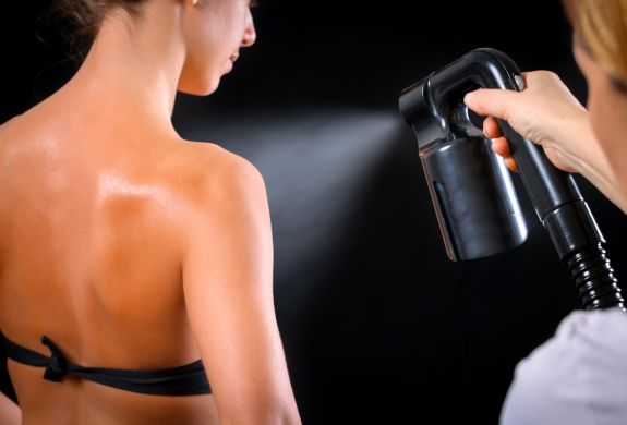 Woman having a full body spray tan