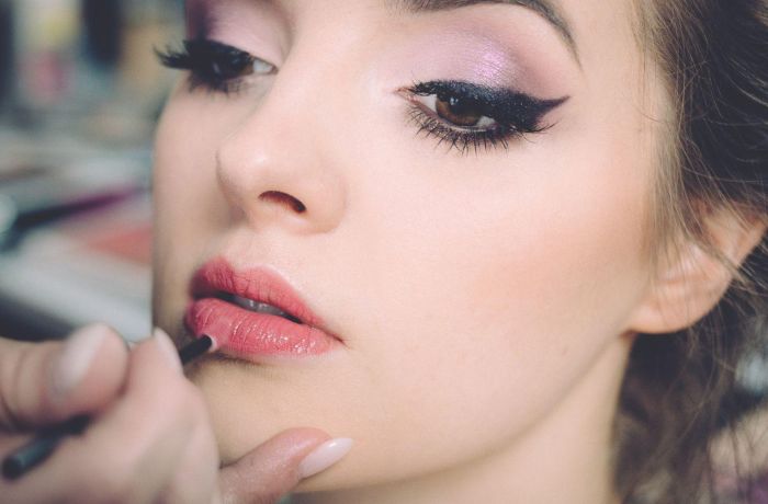 Woman having makeup applied on a makeup tutorial experience 3