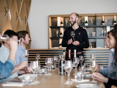 group of people enjoying a wine tasting on a tour of gusbourne estate