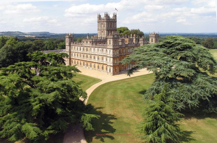 the view of highclere castle which was used as the setting for downtown abbey seen on a guided coach tour of downtown abbey