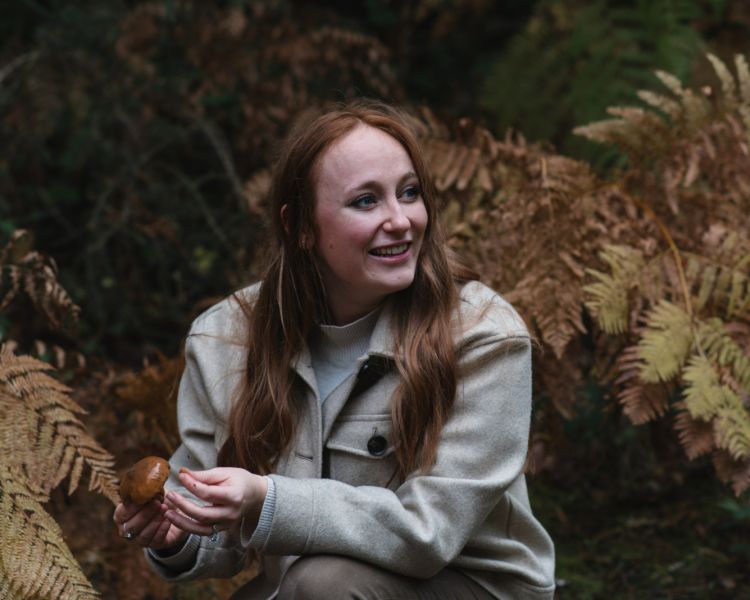 Lady foraging mushrooms