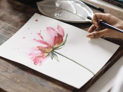 a pink watercolour flower on a piece of white paper done on a watercolour introduction experience
