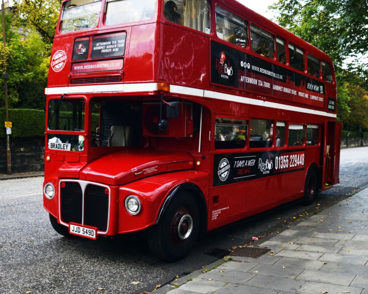 the exterior of the red bus bistro tour bus