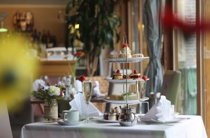 a sparkling afternoon tea laid out on a table at a country house hotel inn hertfordshire