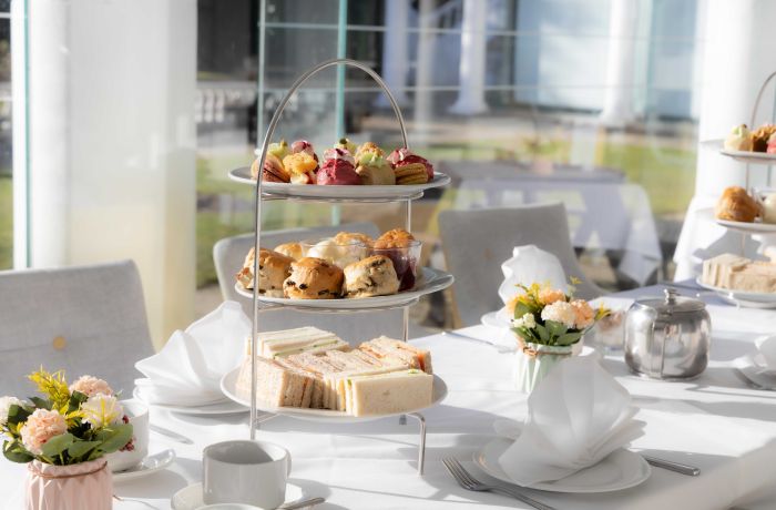 an afternoon tea laid out at a manor house hotel in hertfordshire