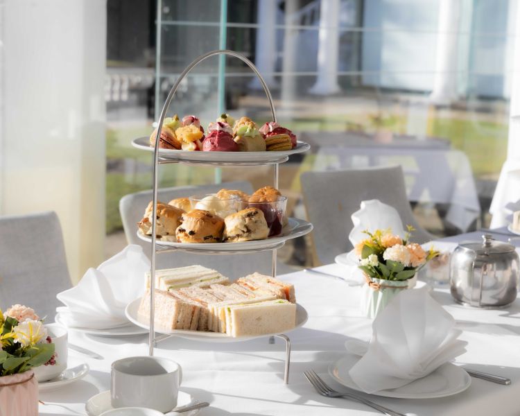 an afternoon tea laid out at a manor house hotel in hertfordshire