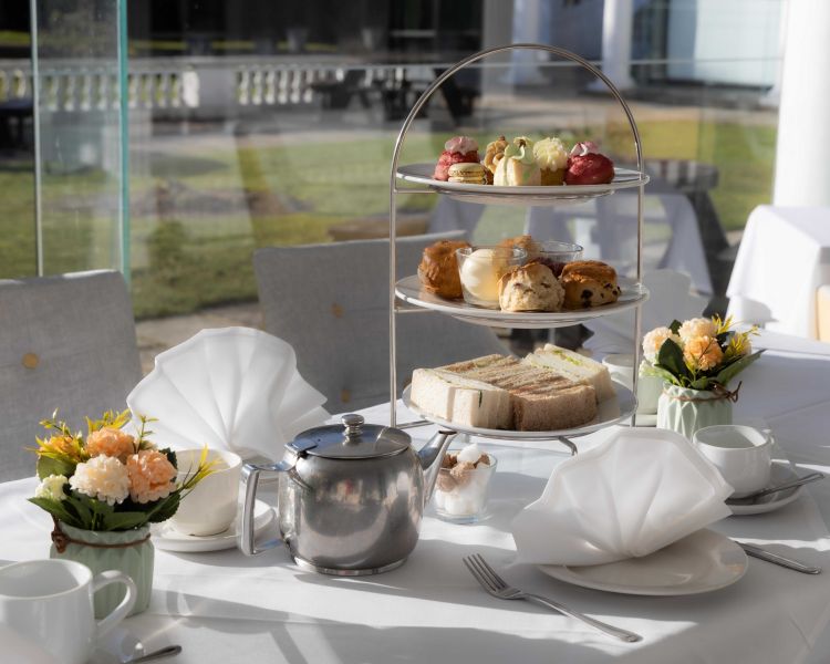 an afternoon tea laid out at a manor house hotel in hertfordshire