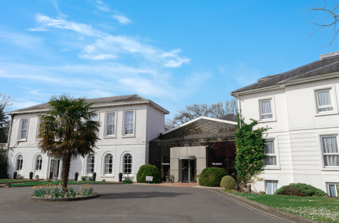 the front of a manor house hotel in hertfordshire