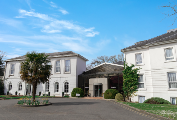 the front of a manor house hotel in hertfordshire