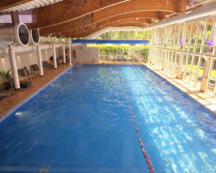 the indoor swimming pool at a manor house hotel in hertfordshire