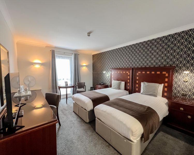 a twin room at a manor house hotel in hertfordshire