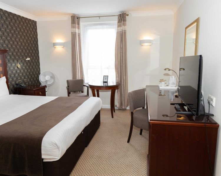 a classic double room at a manor house hotel in hertfordshire