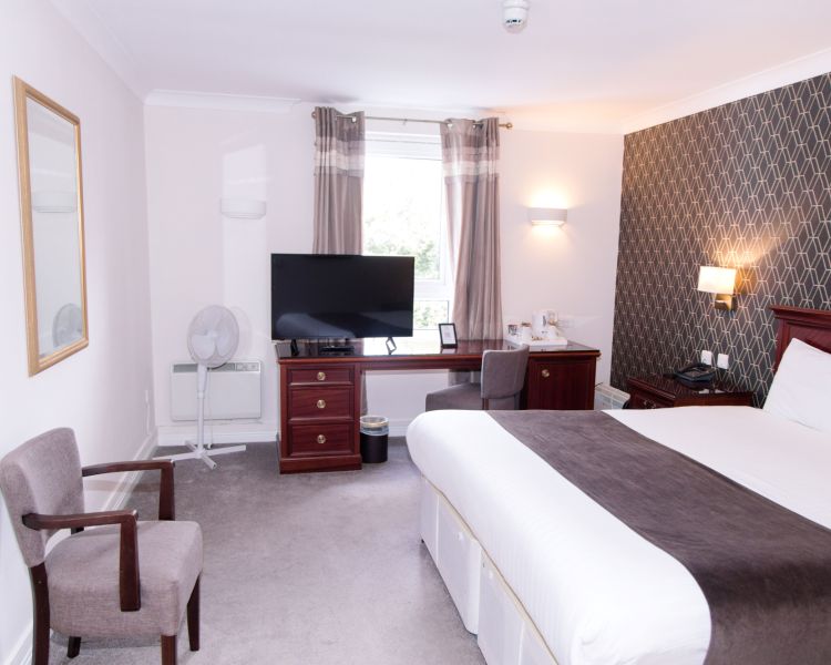 a classic double room at a manor house hotel in hertfordshire