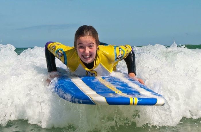 Young woman surfing