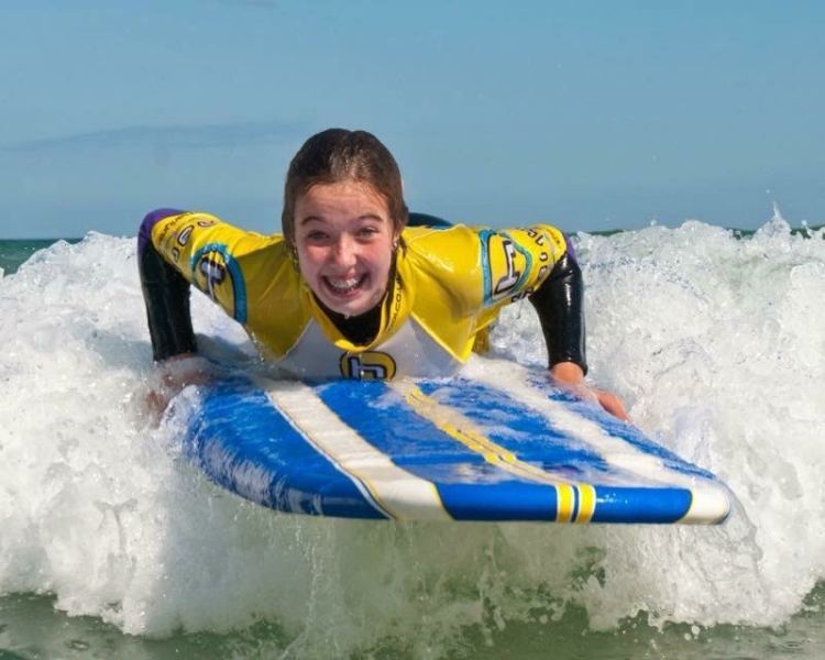Young woman surfing