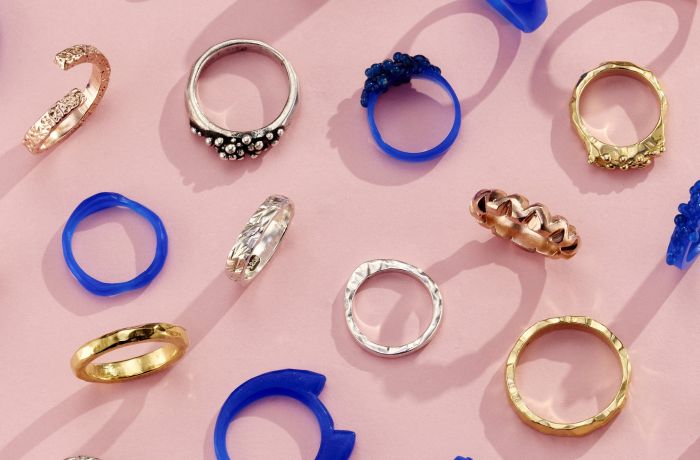 a selection of gold and silver rings and their wax ring models shown as examples of what you can make on a ring making experience