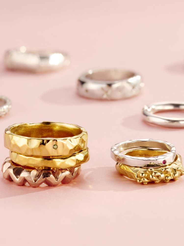 a selection of silver and gold rings shown as examples of what you can make on a ring making experience