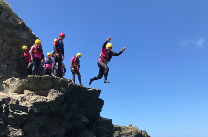 Group of people cliff jumping