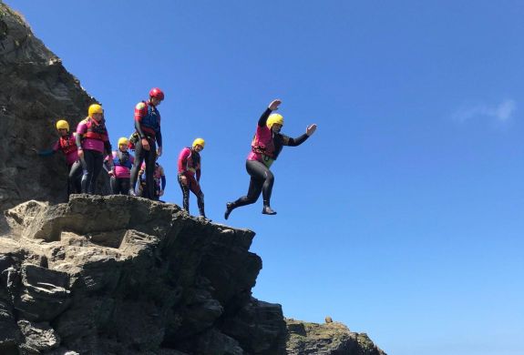 Group of people cliff jumping