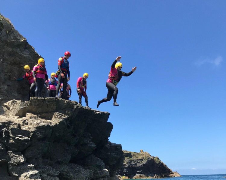 Group of people cliff jumping