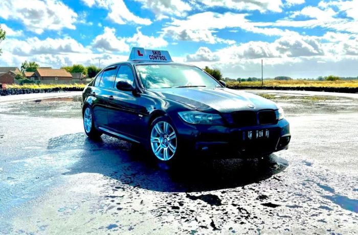 a car parked on a skid pan ready for a skid pan driving experience