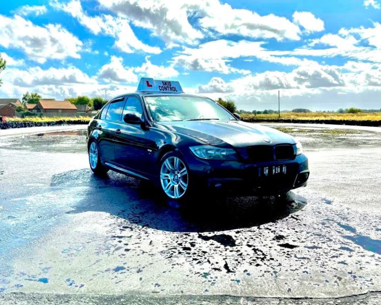 a car parked on a skid pan ready for a skid pan driving experience