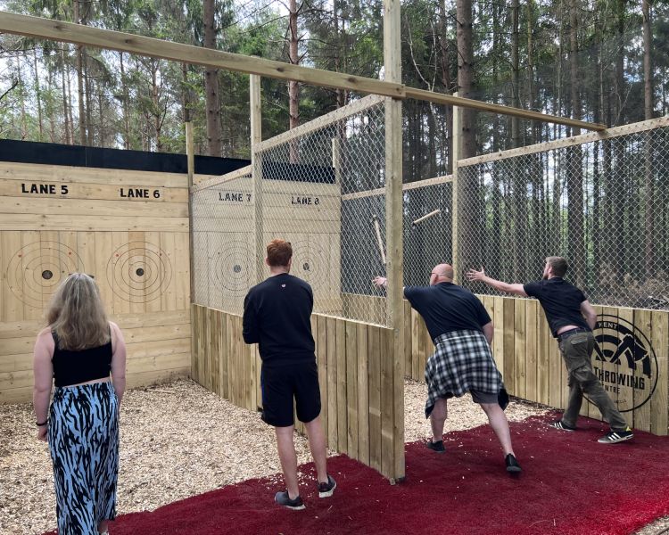 people throwing axes on an axe throwing experience in tunbridge wells in kent